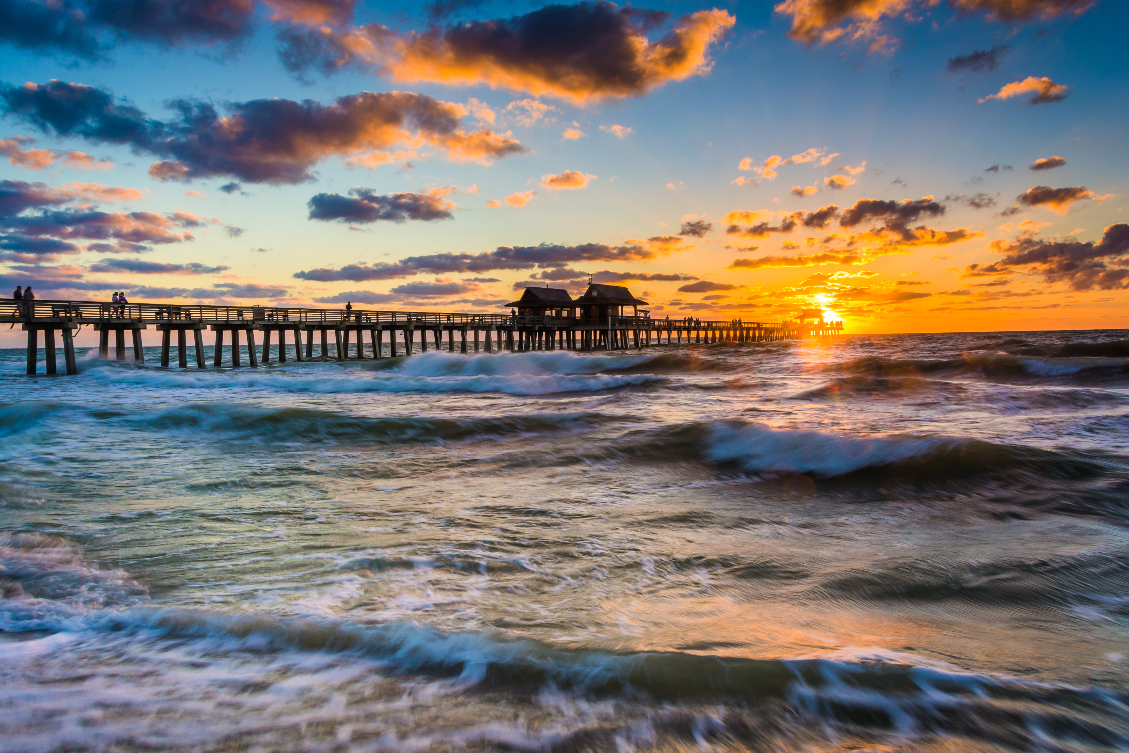 Sunset over the fishing pier and Gulf of Mexico in Naples, Florida